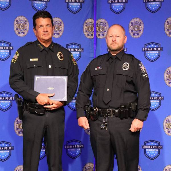 Dothan Officer Receiving a Certificate of Appreciation for Actions he